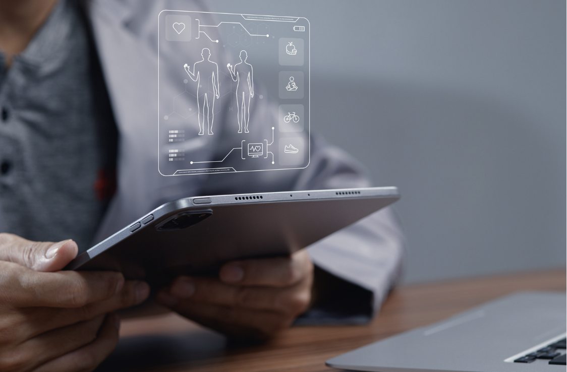 Healthcare professional using a digital health platform on a tablet.